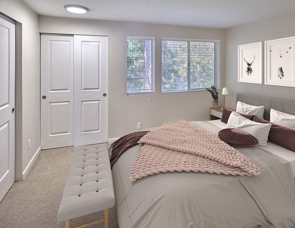 Bedroom that will fit a queen sized bed comfortably. Carpeted with sliding closet doors and 3 medium windows.at Edmonds Gateway, Washington