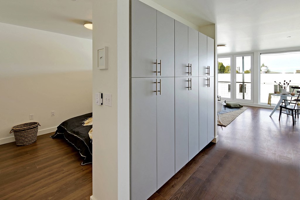 Build-in hallway storage with bedroom and living room visible in the distance at 19th & Mercer, Seattle Washington