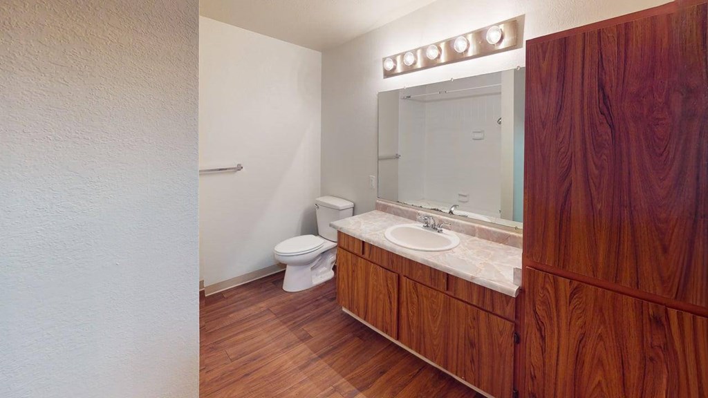 Alternate view of the living room at Heritage Grove Apartments Renton WA highlighting the open layout and natural light from large windows.