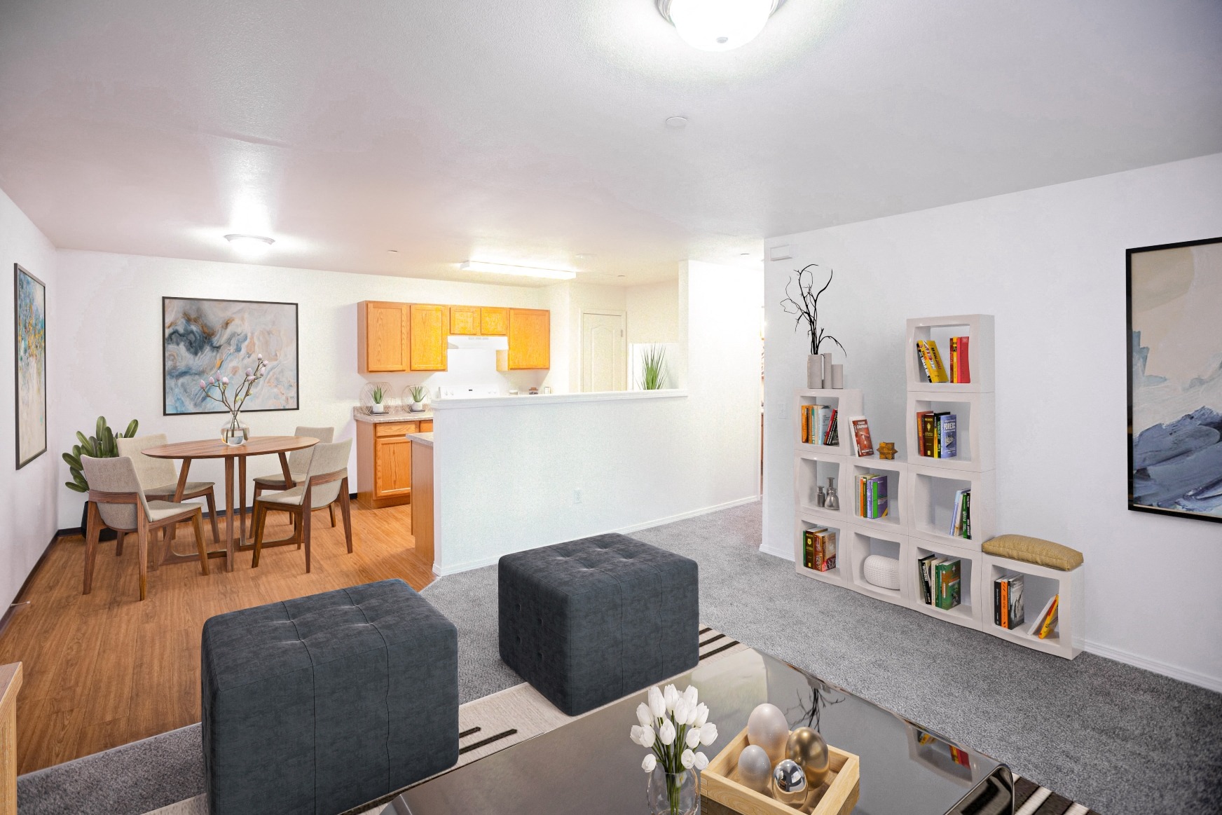 a living room with a dining room and a kitchen with a table and chairs