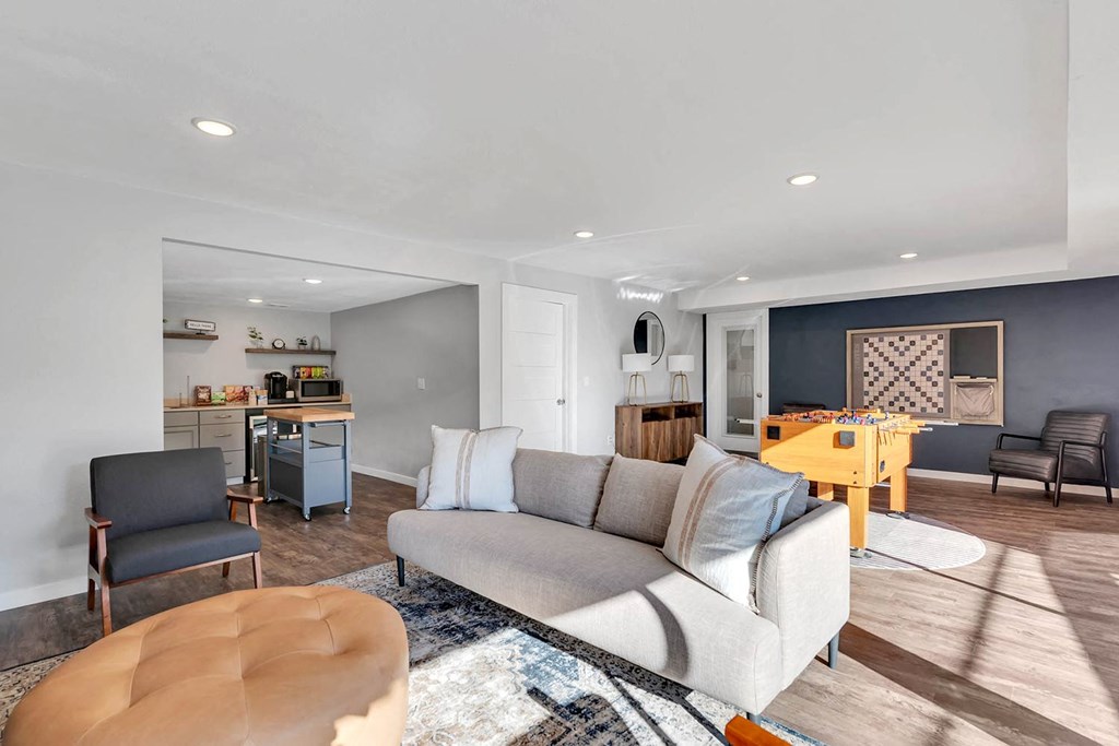 Clubhouse with kitchen, coffee station, microwave, game room with foosball, wall scrabble, couch, chair, ottoman.at Castlerock, Washington, 98801