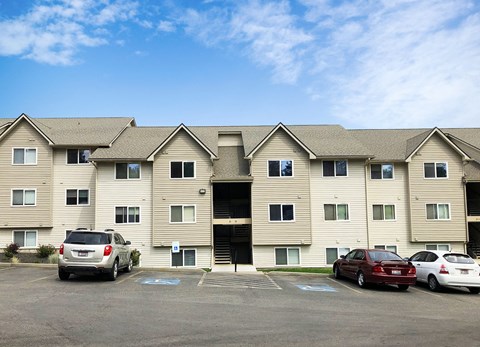 Clearwater Apartments exterior shot with community parking in front.at Clearwater, Post Falls, ID 83854