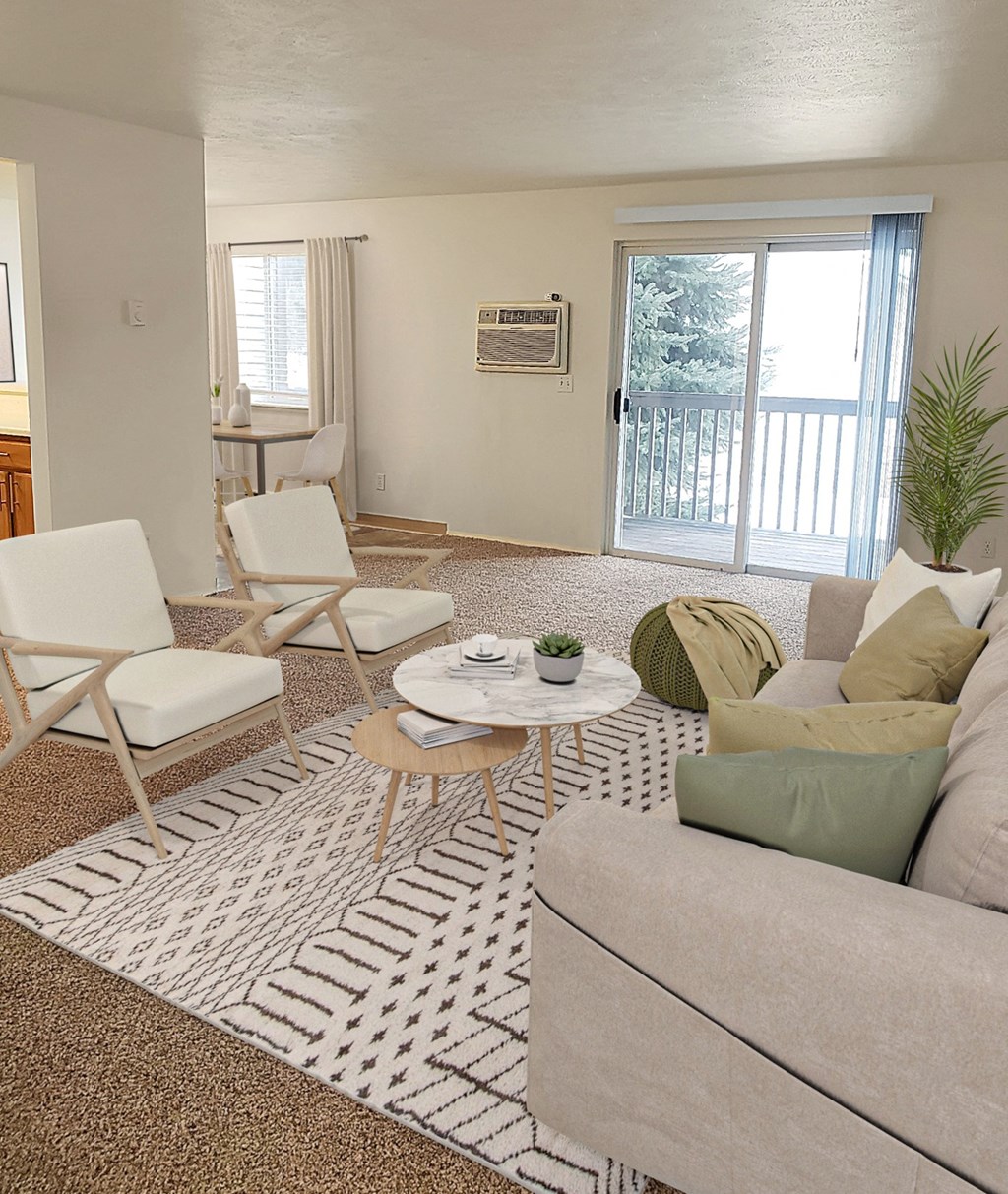 Carpeted living room with sliding glass doors to oversized patio.at Clearwater, Post Falls