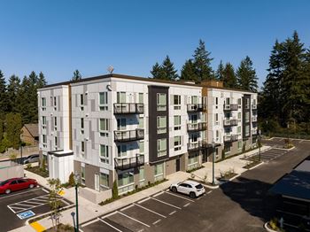an aerial view of an apartment building in a parking lot at The Duo, Washington, 98466
