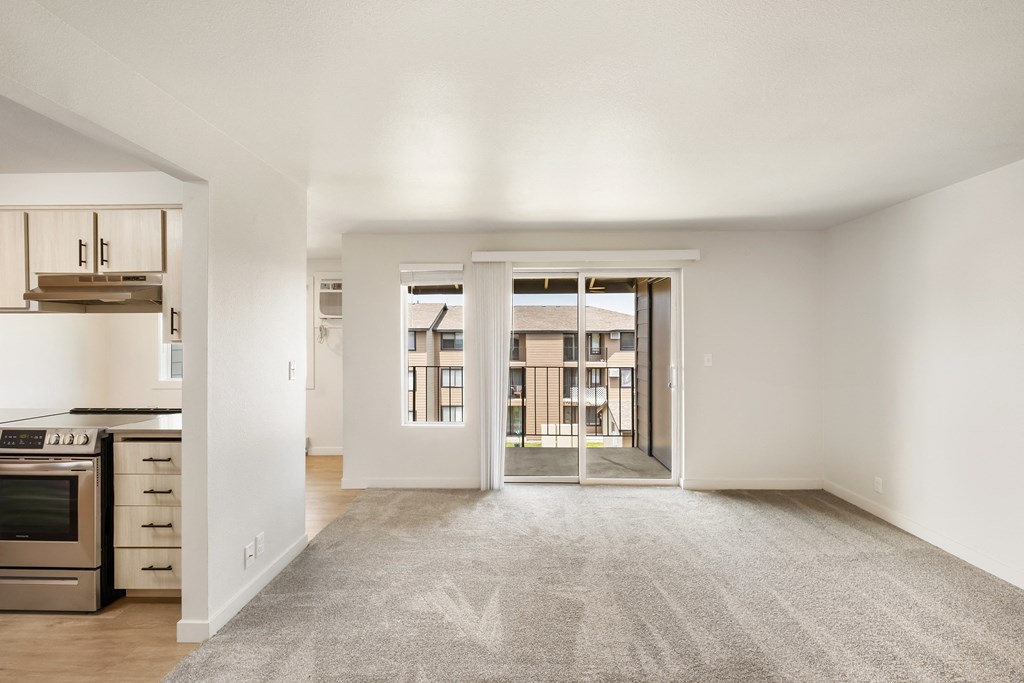an empty living room with a kitchen to the left  at Brix, Walla Walla, WA, 99362