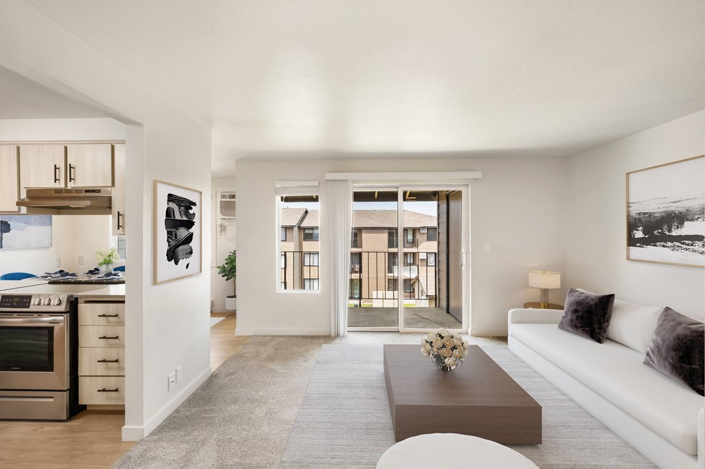 a living room with a white couch and coffee table  at Brix, Walla 