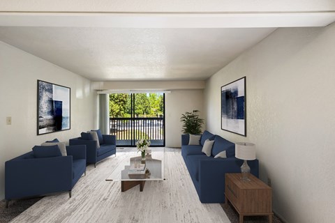 a living room with blue couches and a coffee table