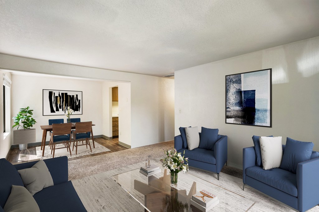a living room with blue couches and chairs and a dining room table at Cedarwood, Wenatchee, WA