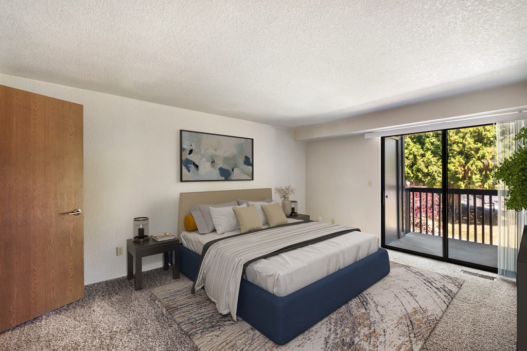 a bedroom with a bed and a sliding glass door at Cedarwood, Wenatchee, WA