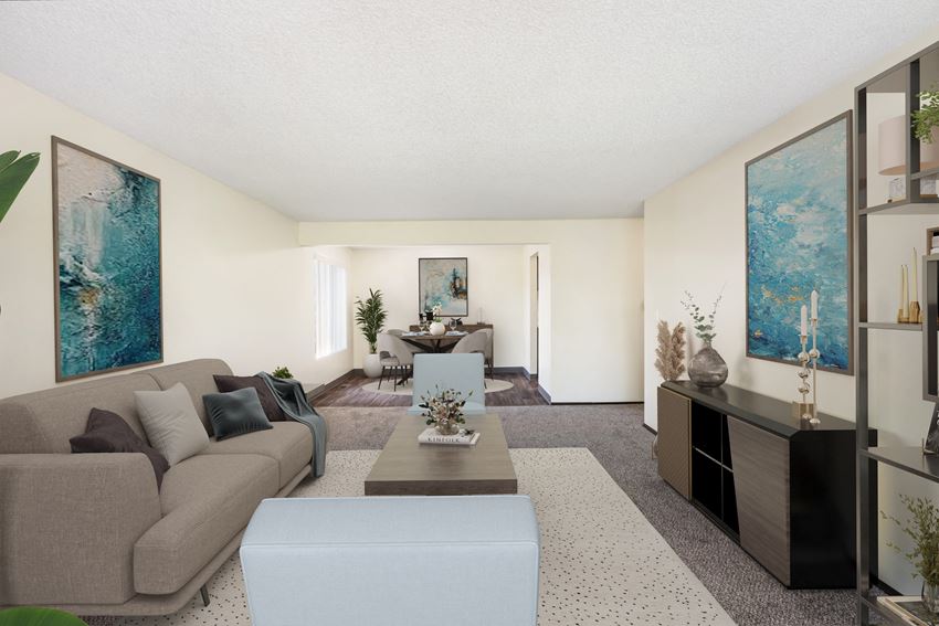 a living room with a couch coffee table and a dining room table in the background a living room with a couch coffee table and a dining room table in the background at Castlerock, Wenatchee Washington - Photo Gallery