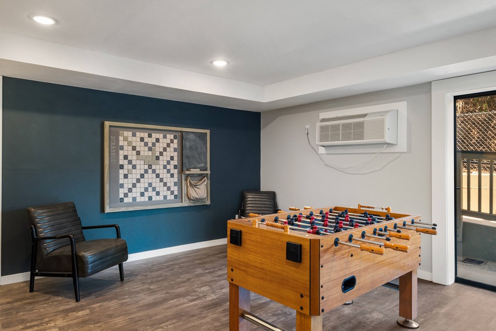 a game room with a foosball table and air conditioner at Castlerock, Washington, 98801