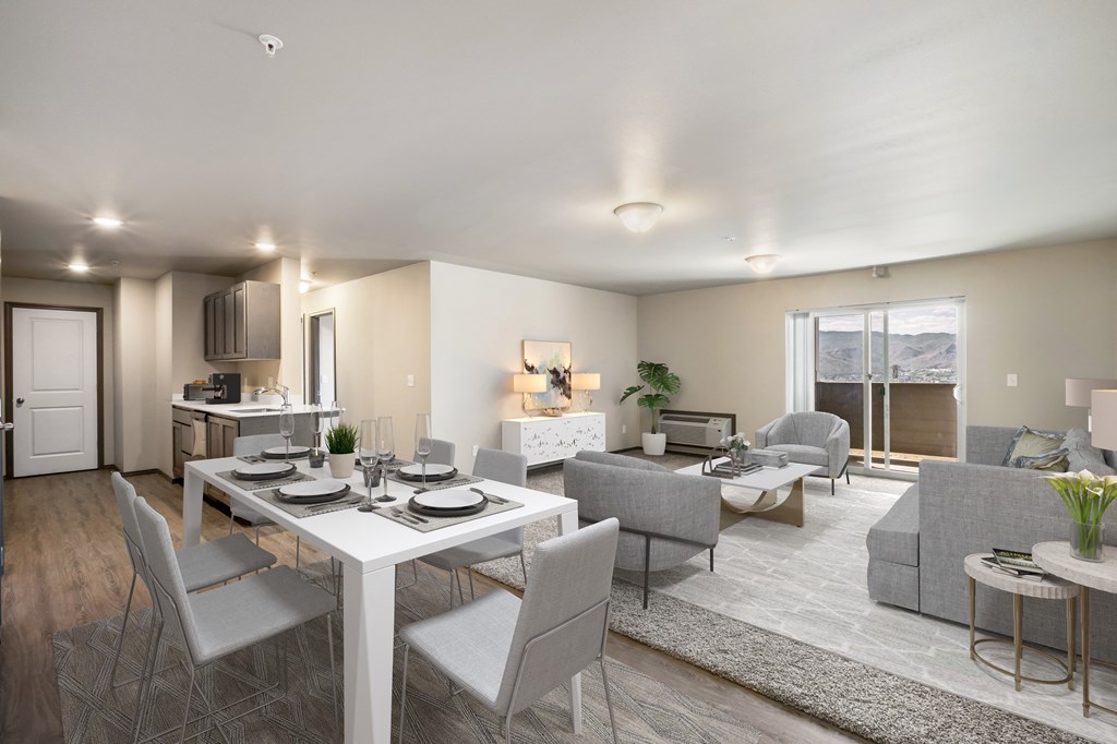 a living room and dining room with a white table and chairs  at Altitude, East Wenatchee, WA, 98802