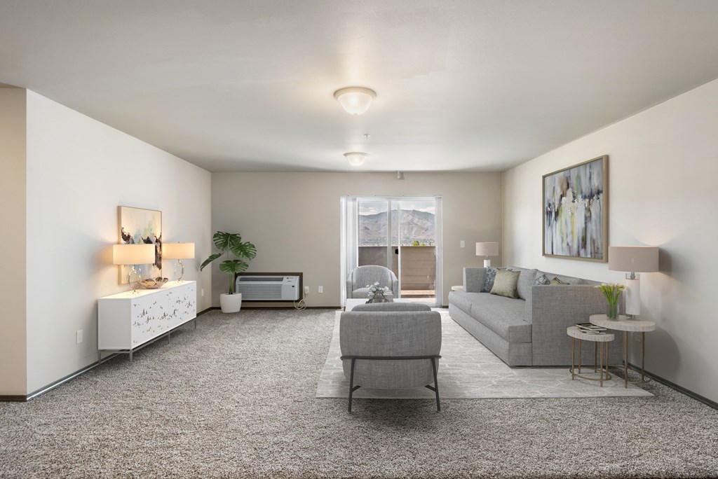 a living room with white walls and carpet  at Altitude, East Wenatchee, 98802
