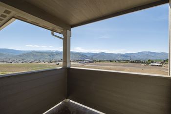 the view from the porch of a cabin with a view of the mountains at Altitude, Washington, 98802