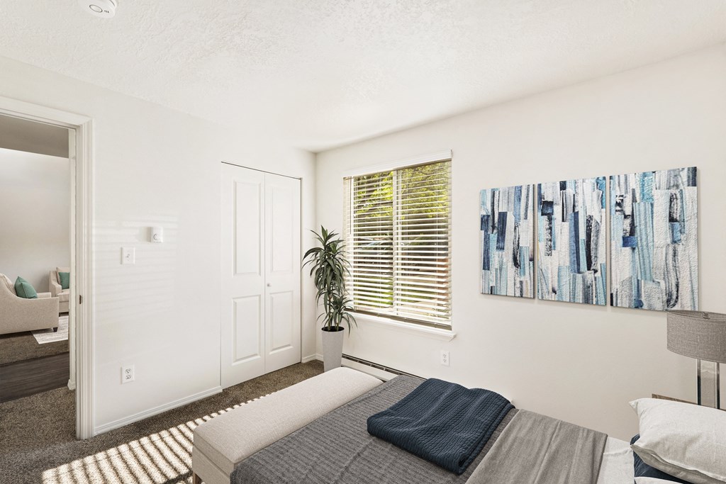 a bedroom with a bed and a window a bedroom with a bed and a window at Park View Apartments, Wenatchee, 98801