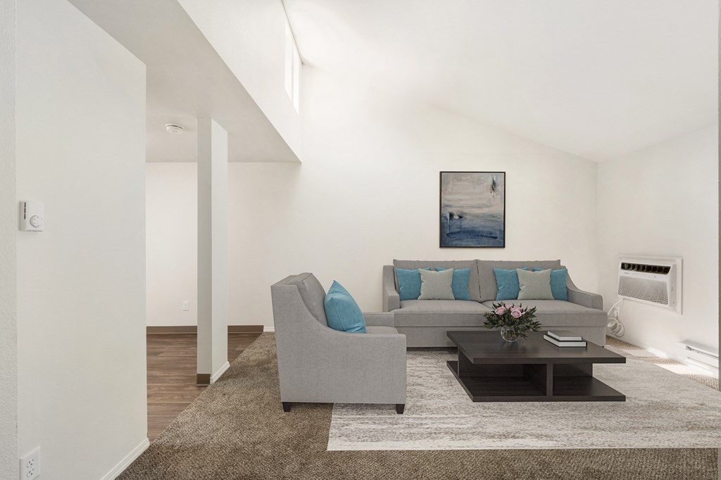 a living room with white walls and a brown rug at Park View Apartments, Wenatchee, WA
