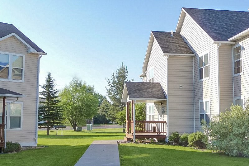 A residential area with houses and a clear sky.