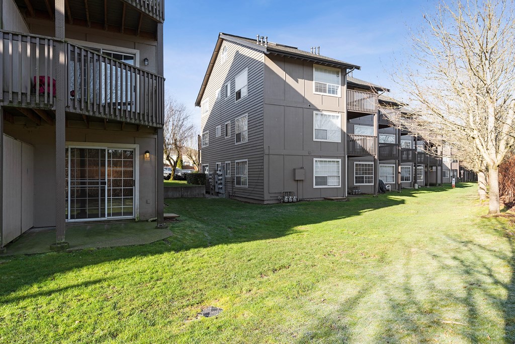 Community Exterior Exterior of Capitol Crossing Apartments with balconies and patios lined with green grass and trees.at Capitol Crossing, Washington