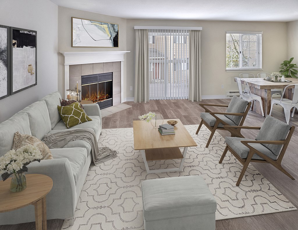 Apartment living room with a wood burning fireplace and staged furniture. Right off the living room are doors to the outdoor patio at Arterra Apartments, Kent, 98030