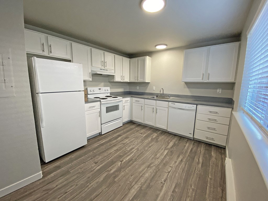 Spacious l-shaped kitchen, natural light, white appliances, top and bottom cabinet storage.at Quilceda Gardens, Marysville, 98270