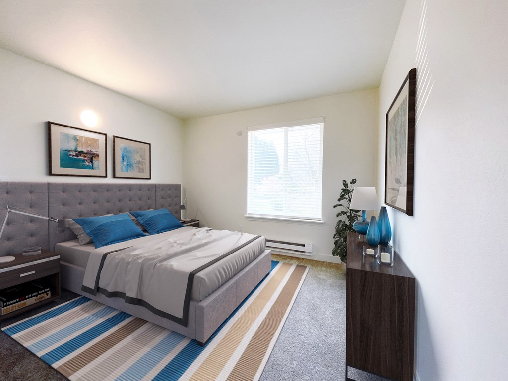 a bedroom with a bed, a dresser, 2 side tables and a large sunny window.at The Trail, Snohomish