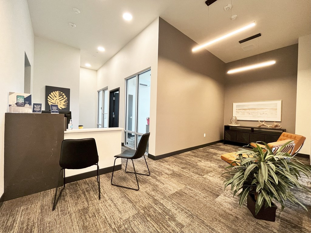 an empty office with a table and chairs and a reception desk at The Duo, University Place Washington