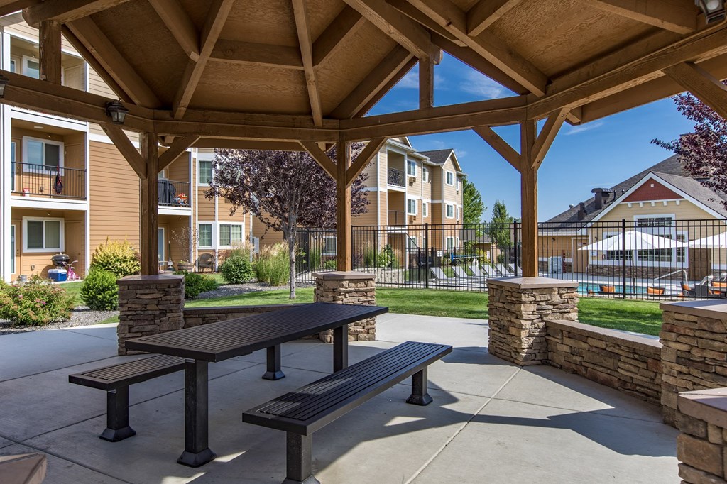 an outdoor patio with a pavilion in front of an apartment building  at Quail Springs, West Richland, 99353