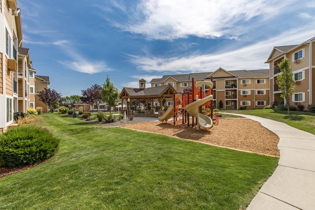 Exterior of Quail Springs grounds, green grass and playground