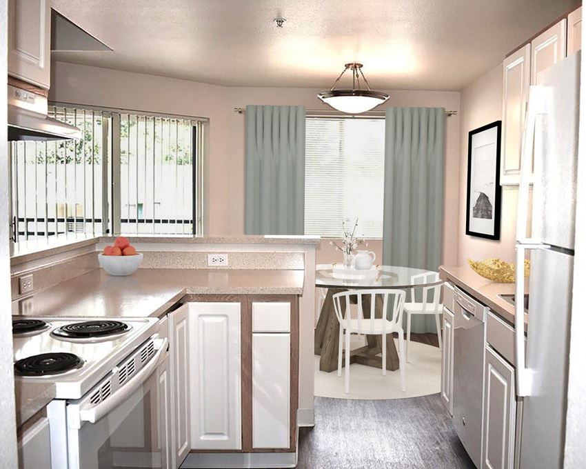 Kitchen and Dining Kitchen with a fridge and stove with a cooktop looking out to the dining area which has a round glass table and chairs, an overhead light, and glass doors leading outside.at Sitka Heights, Fife, WA