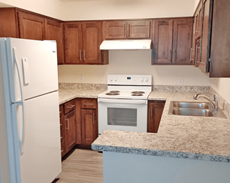 a kitchen with a counter and a refrigerator at Rock Creek, Billings, 59102