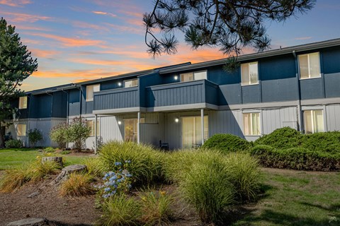 A building with a blue sky and clouds in the background.