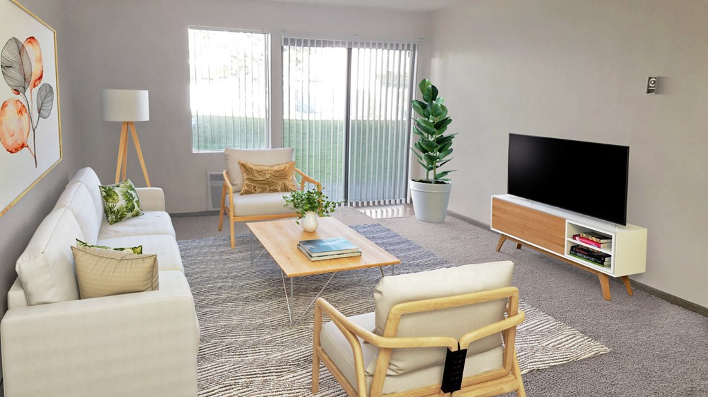 Bright living room with a window and sliding glass doors with a view of manicured lawn. Staged with couch, chairs, tv, plant.at Laurel Park, Twin Falls