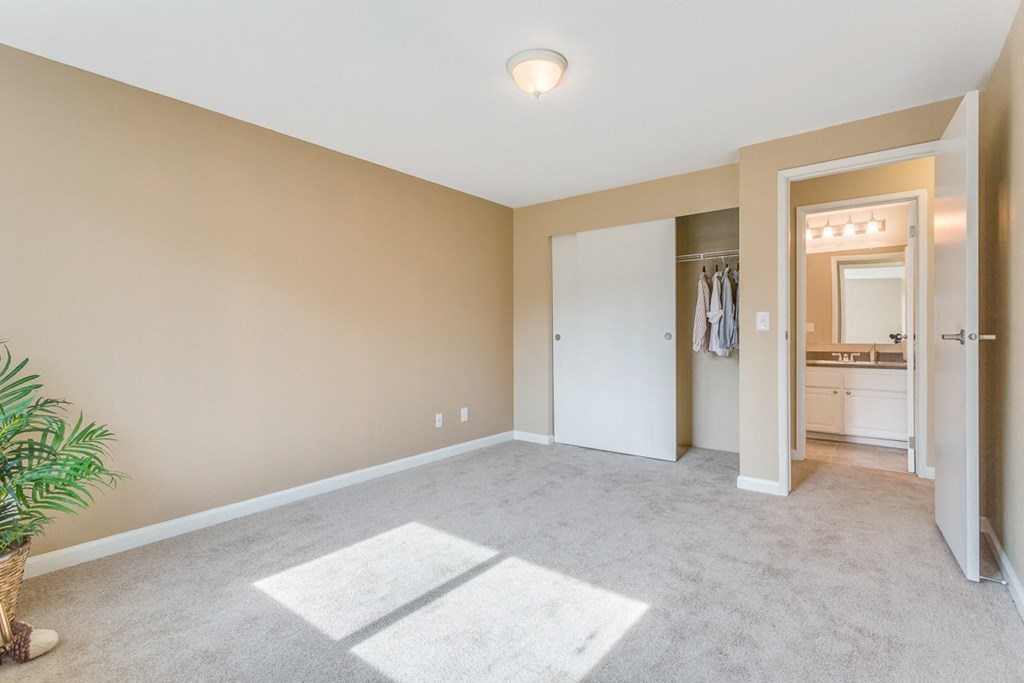 an empty living room with a closet and a bathroom at Springfield, Washington, 98055