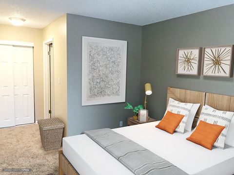 a bedroom with a white bed and two pictures on the wall