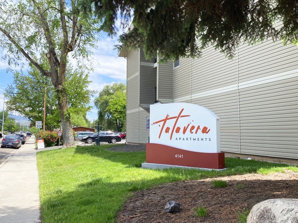 a sign in front of a building with a parking lot in the background  at Talavera, Boise, 83705