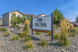 Pine Tree Park entrance with large sign and landscaping in Kennewick wa.