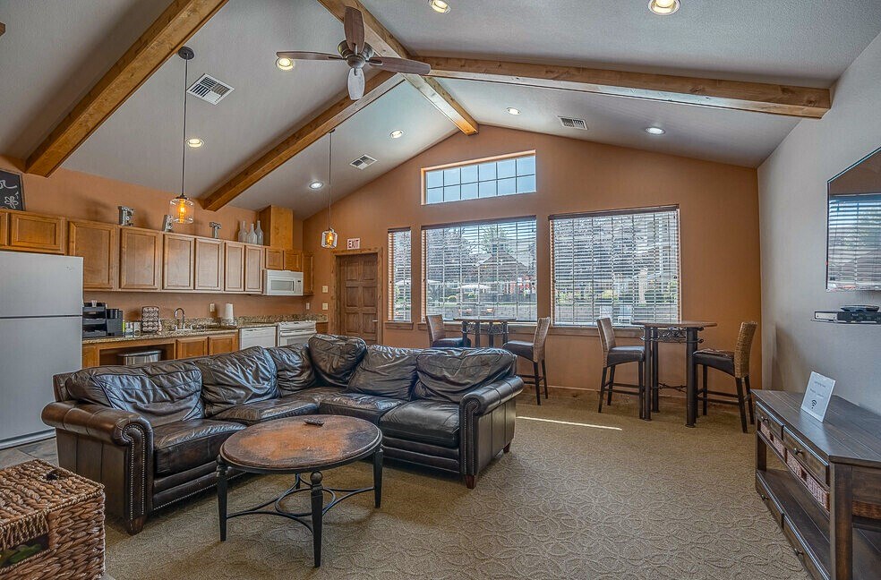 Quail Springs Apartments clubhouse. large couch and big windows
