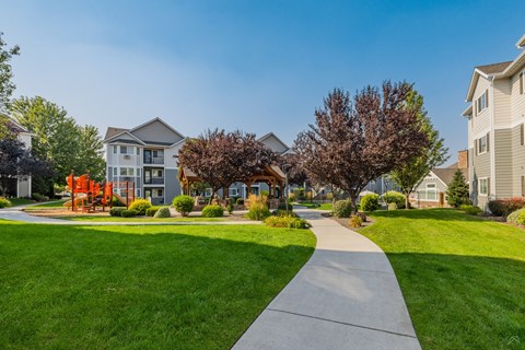A residential area with houses and a walkway.