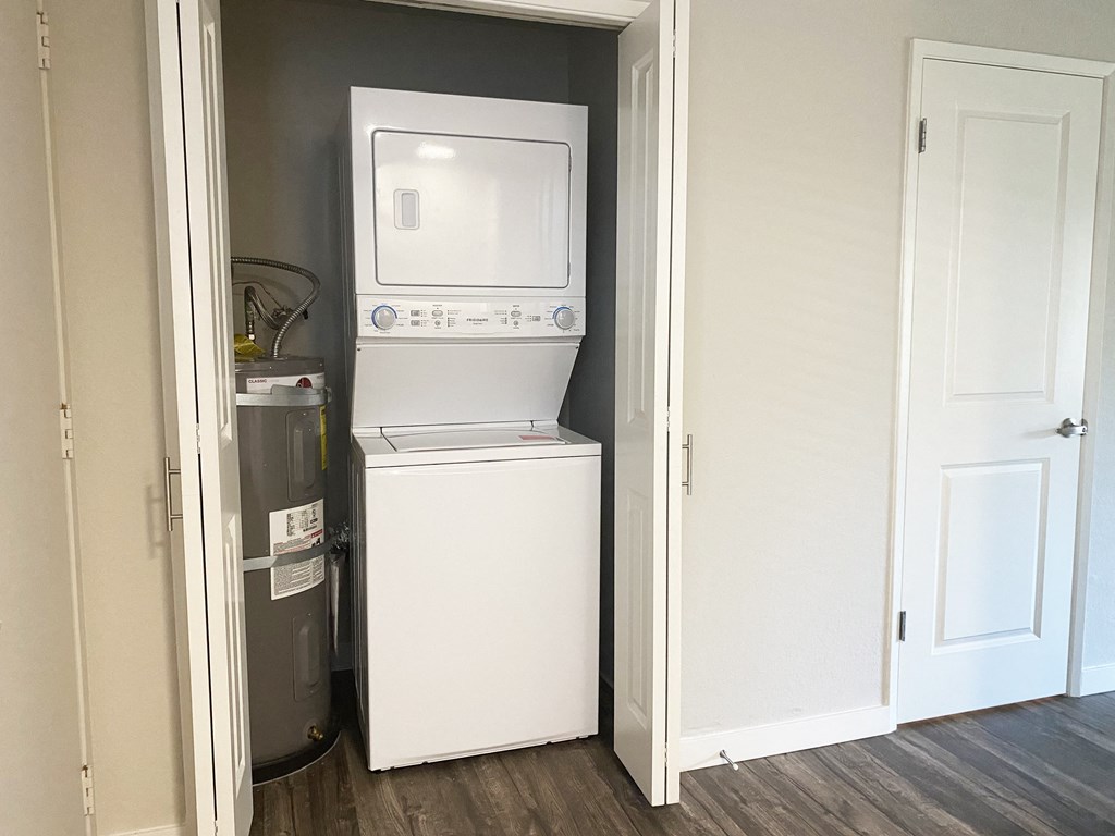 Washer and dryer in hallway off kitchen and living room
