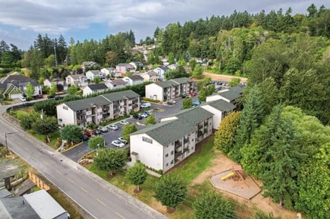 an aerial view of a neighborhood with houses and trees  at Sitka Heights, Fife, WA, 98424