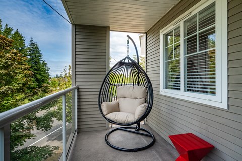 a swing chair on the porch of a home at Sky Vue, Washington, 98229