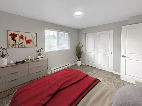 Bedroom with gray carpet, double sliding door closet, large window with blinds staged with dresser, wall art, a bed, and plant.at Quilceda Gardens, Marysville