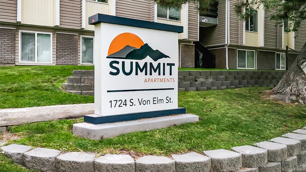 a sign for summit apartments in front of a building at Summit, Idaho, 83201