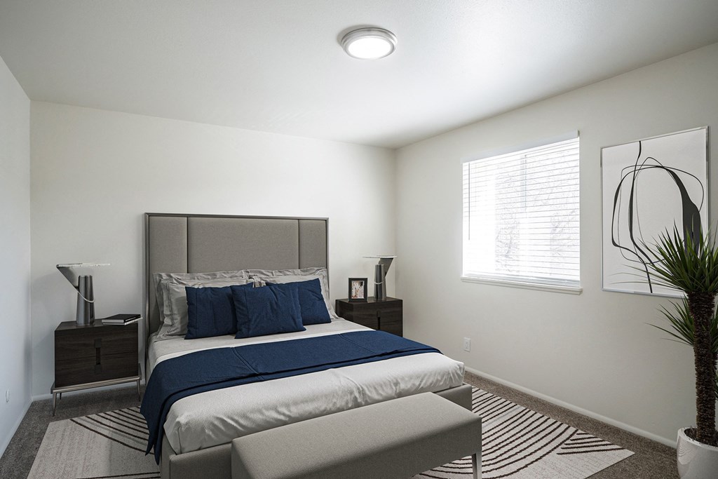 a bedroom with a bed and two night stands at Summit, Pocatello, ID