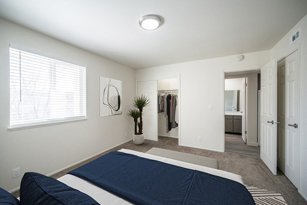 a bedroom with a large bed and a large window at Summit, Idaho
