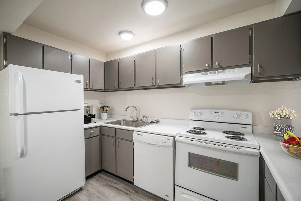 a kitchen with white appliances and gray cabinets at Summit, Pocatello, 83201