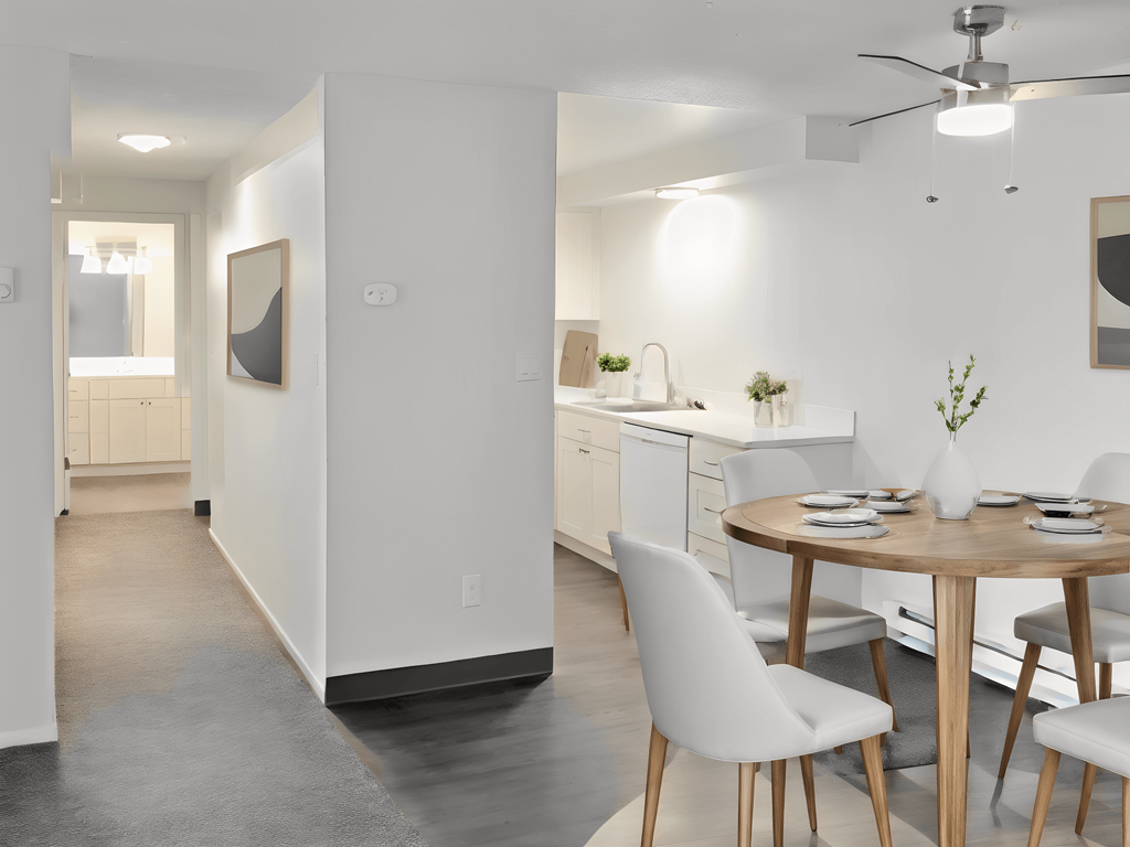 a living room and dining room with a table and chairs