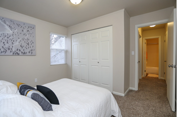 Bedroom with full side bed and 2 panel closet doors - Photo Gallery 9
