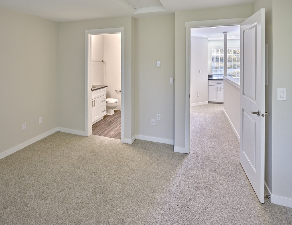 an empty bedroom and bathroom with a door open to the living room at Edmonds Gateway, Edmonds, WA 98026