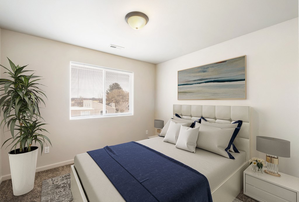 A furnished bedroom with a large window, gray carpets, and overhead lighting. Stayed with queen-size bed, side tables, and a house plant. at Pine Tree Park, Kennewick, 99337